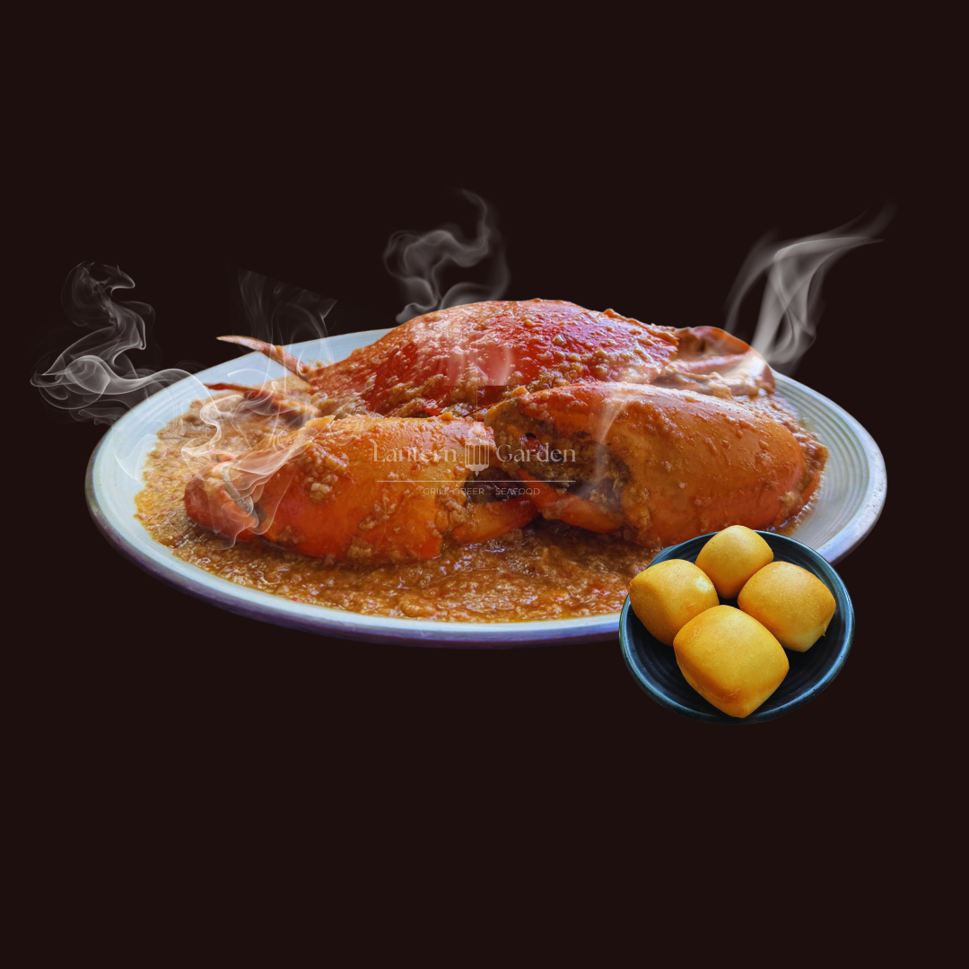 Singapore Chilli Crab on a white plate with bun